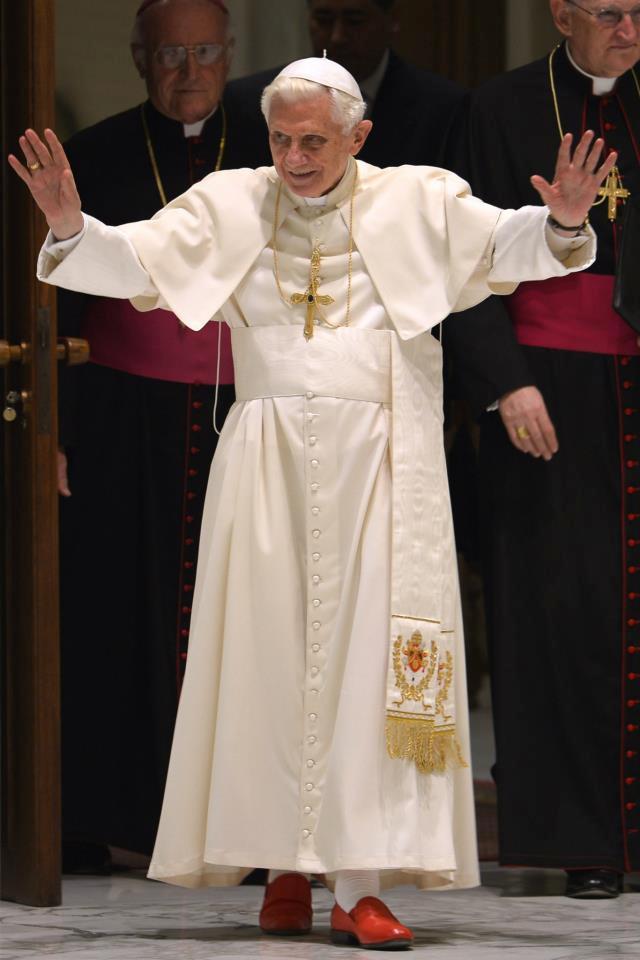 Pope Benedict XVI waves as he arrives for his weekly general audience at the Paul VI hall at the Vatican on June 20, 2102 b.jpg